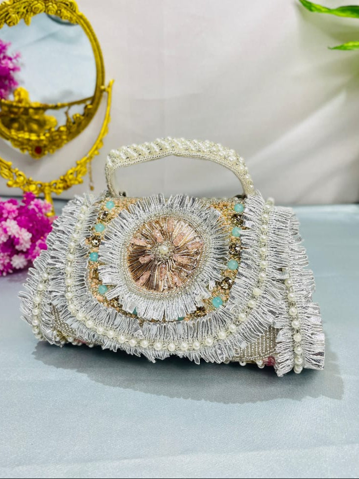 Noor silver-tone clutch with a central medallion, pearl-style handle and layered gota detailing
