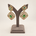 Front view of emerald-green statement earrings with real doublet stones
