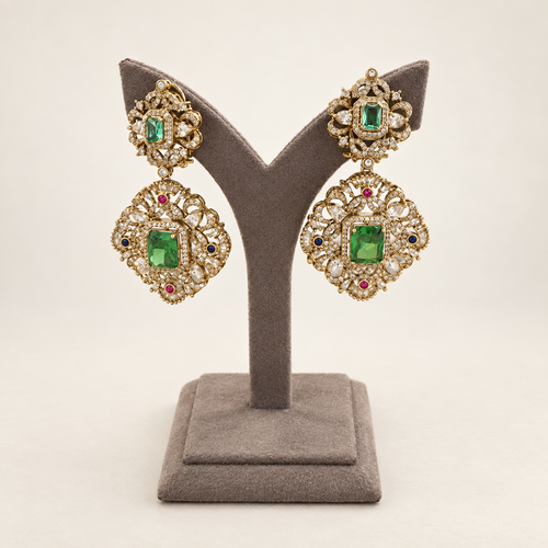 Front view of emerald-green statement earrings with real doublet stones