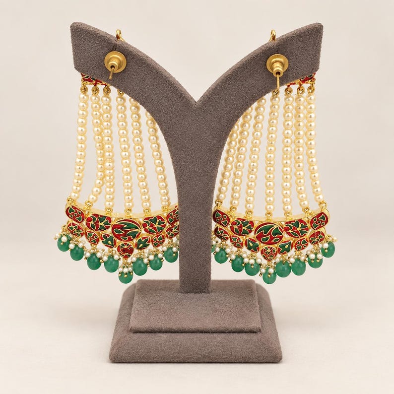 Reverse view showing red and green meenakari-style enamel detailing
