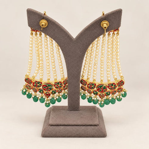 Reverse view showing red and green meenakari-style enamel detailing